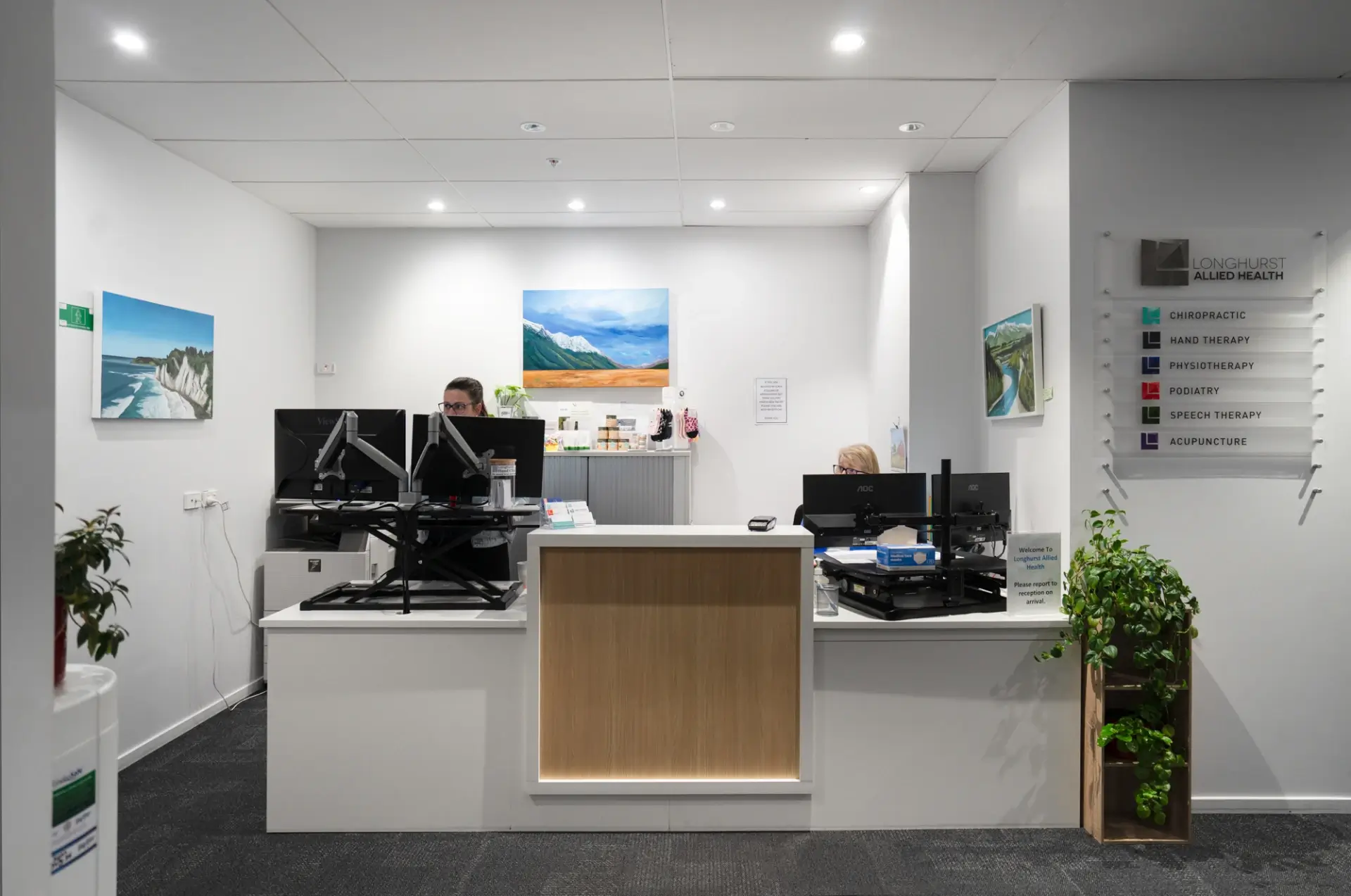 Modern medical clinic reception desk with staff
